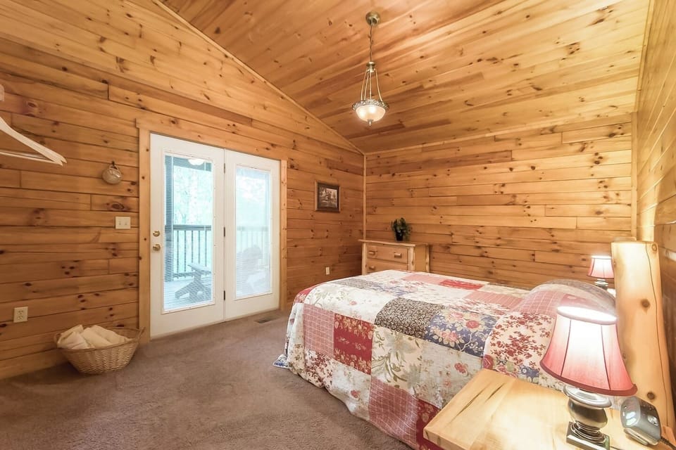 King sized bedroom with direct rear porch access