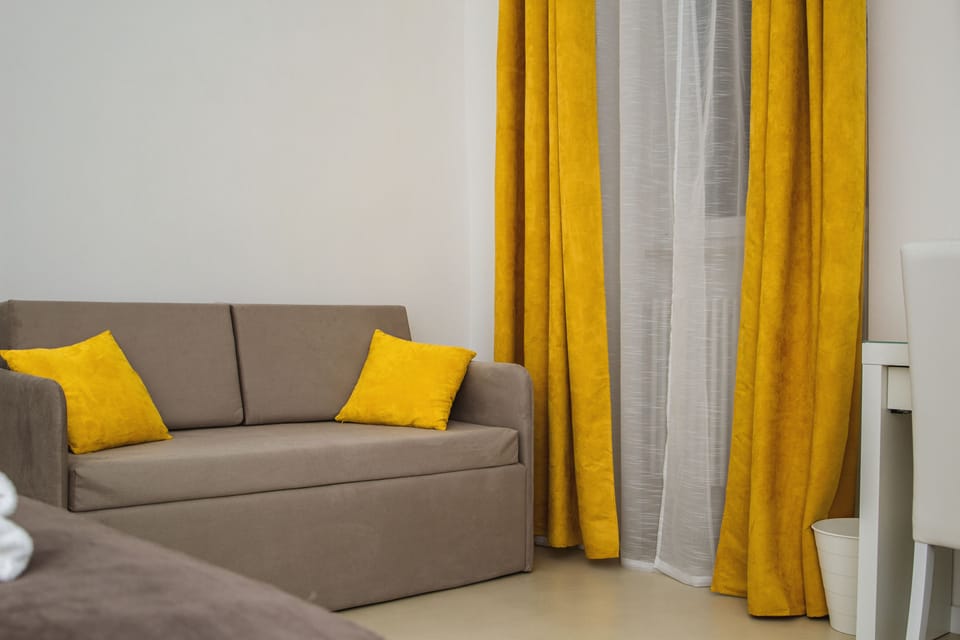 Quadruple Room, Private Bathroom | In-room safe, individually decorated, individually furnished, desk