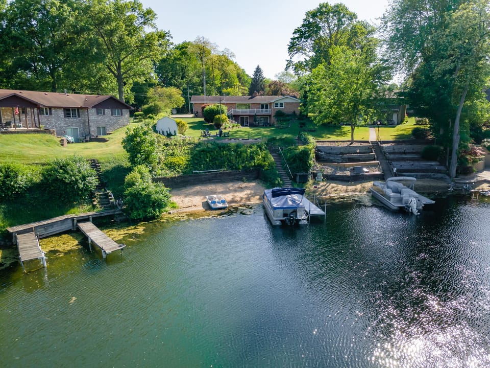 Private beach overlooking the swimming hole on “The Venice of Paw Paw Lake”