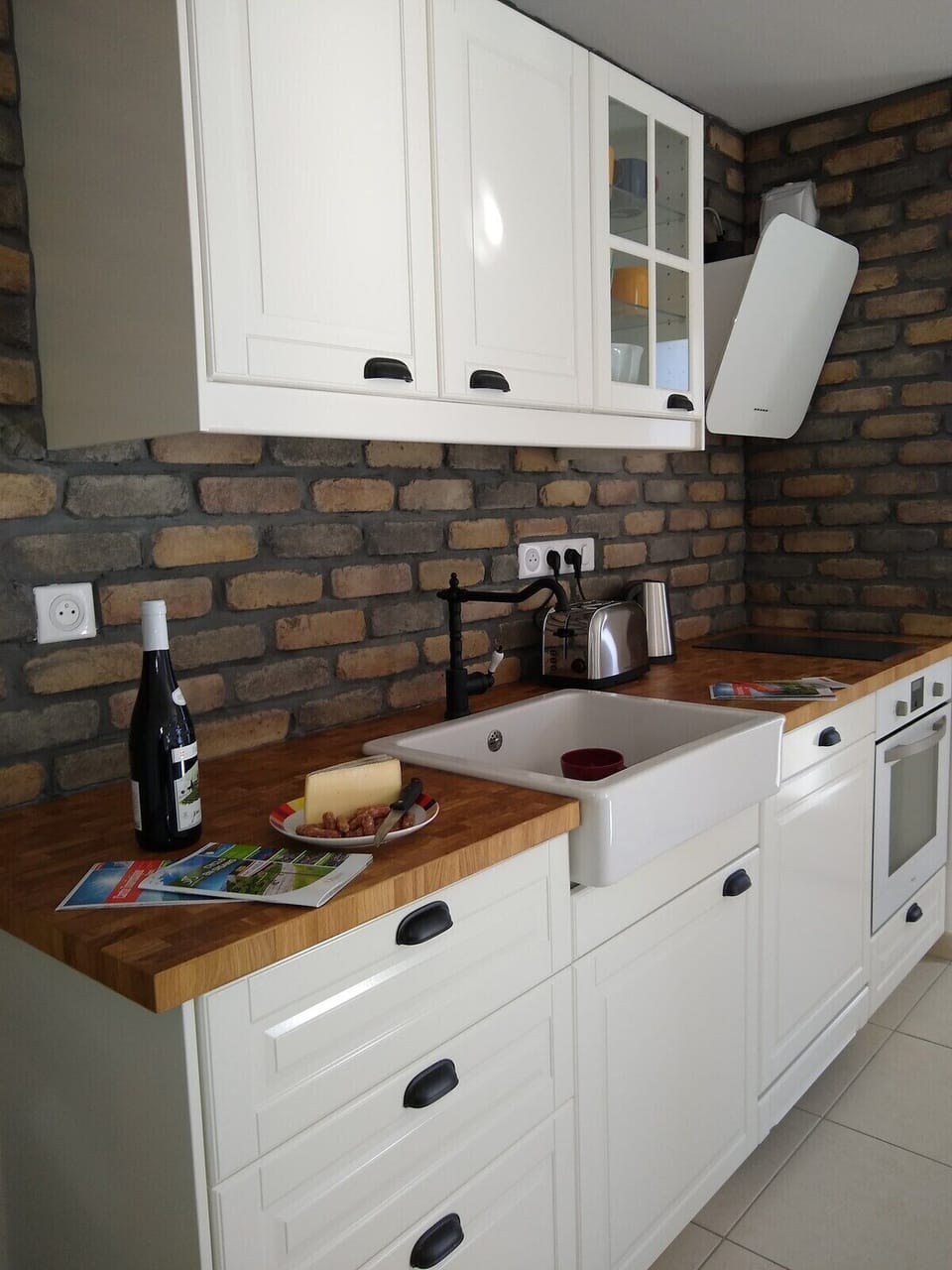 The lovely open plan kitchen has a dishwasher and is equipped to an extremely high level for self catered holidays.