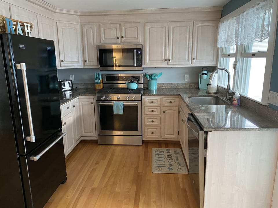 Fully equipped kitchen designed for vacation living, perfect for preparing family meals and beach-day snacks during your Salisbury Beach getaway.