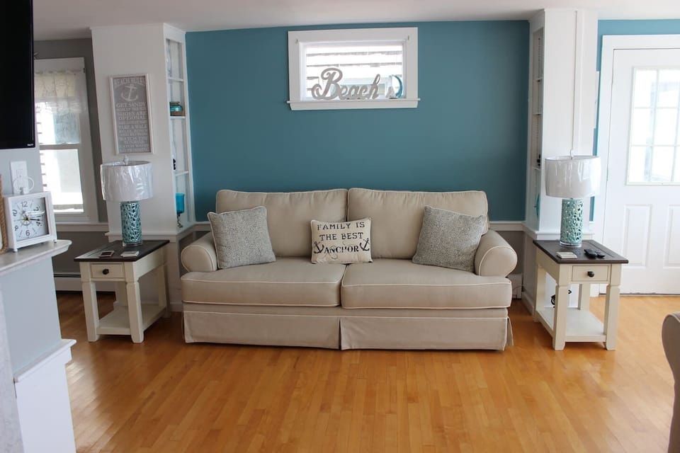 Spacious oceanfront living room with comfortable seating, perfect for relaxing after a day at Salisbury Beach while enjoying coastal views and natural light.
Sofa - Pulls out to a Queen Sleeper