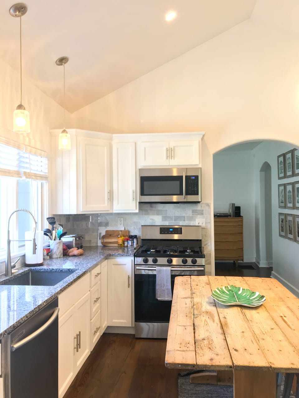 Kitchen has an island, large counterspace, new SS appliances (gas range, DW)