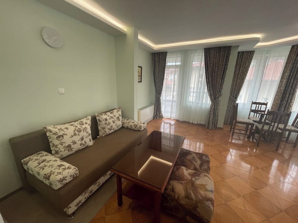 Basic Apartment, 1 Bedroom, Balcony, City View | Living area | 28-inch flat-screen TV with cable channels, TV