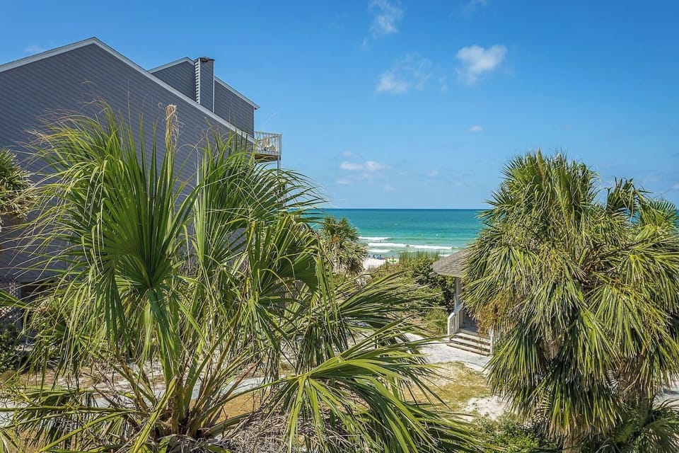 Pour your morning coffee and walk straight to the deck — the Gulf is right there, waiting. This is the view you booked the trip for.