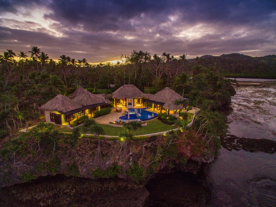 Villa surrounded by tropical gardens and lawns and the Koro Seas