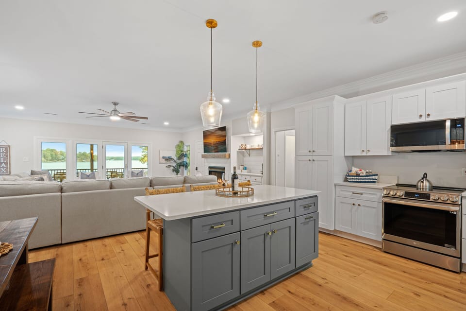 Fully stocked kitchen with island seating for 3.