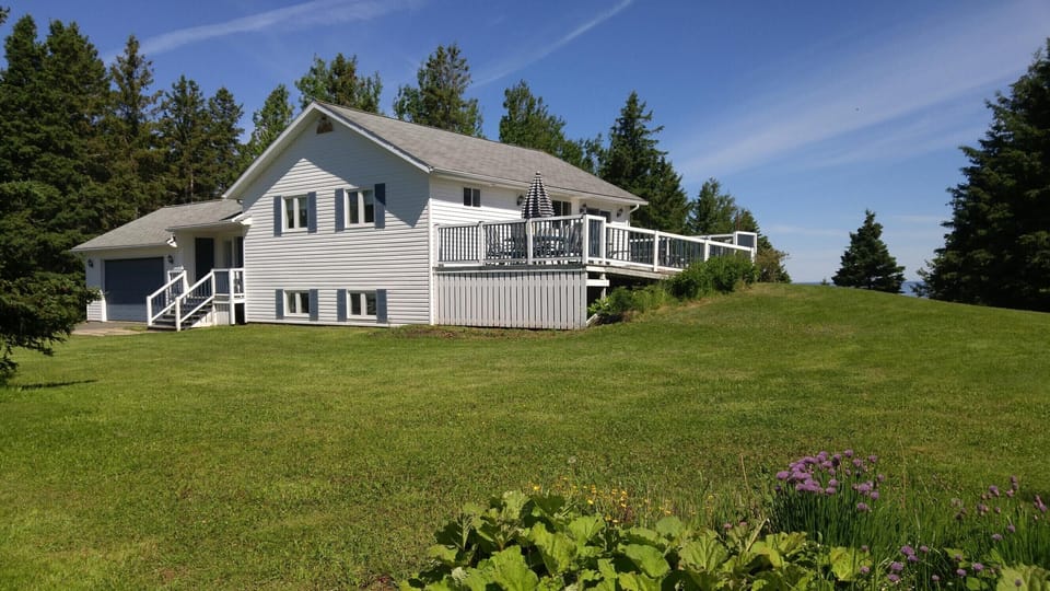 Front of house with side deck.