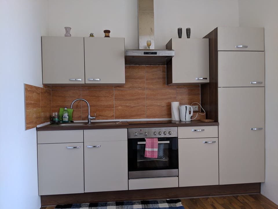 Apartment, Garden View | Private kitchen | Full-size fridge, microwave, oven, stovetop
