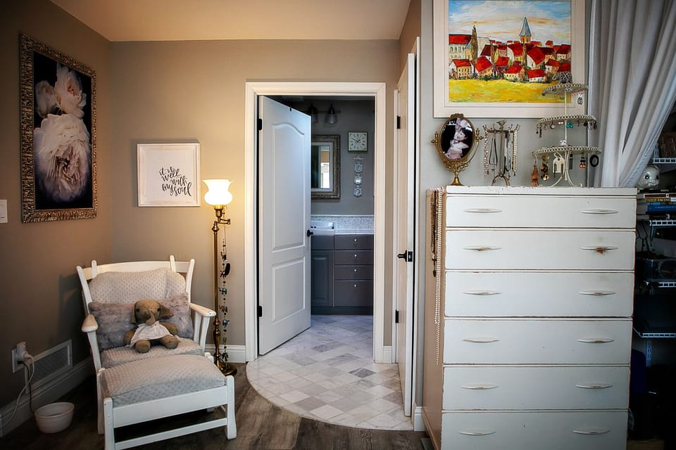 Upstairs has a private space for the toilet and a double sink + shower/tub. 