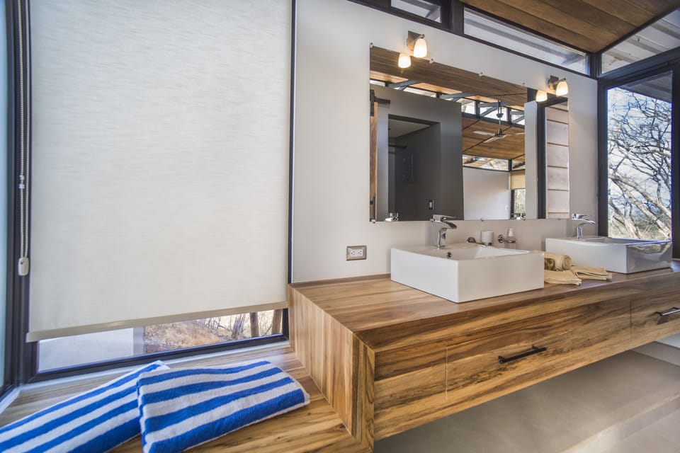Exclusive Studio Suite, 1 King Bed, Ocean View | Bathroom | Shower, rainfall showerhead, eco-friendly toiletries, towels