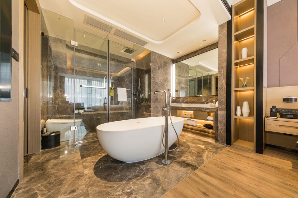 Deluxe Suite, 1 King Bed | Bathroom | Free toiletries, hair dryer, slippers, electronic bidet