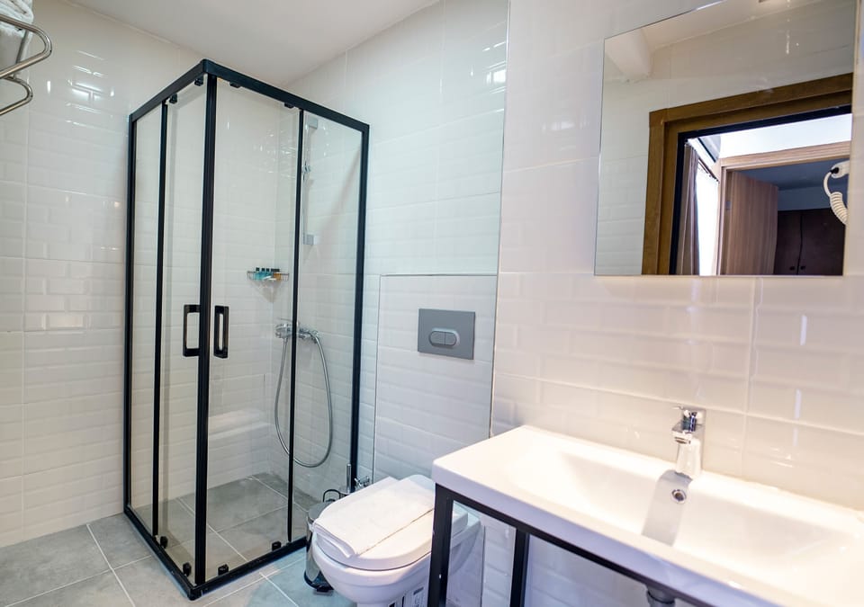 Standard Quadruple Room | Minibar, in-room safe, soundproofing, free WiFi