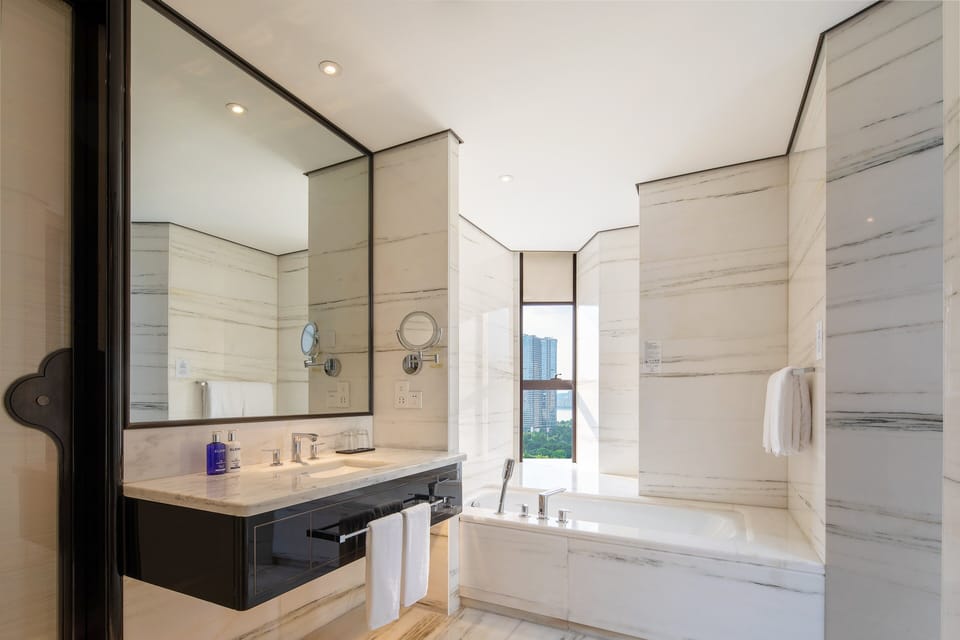 Separate tub and shower, rainfall showerhead, free toiletries