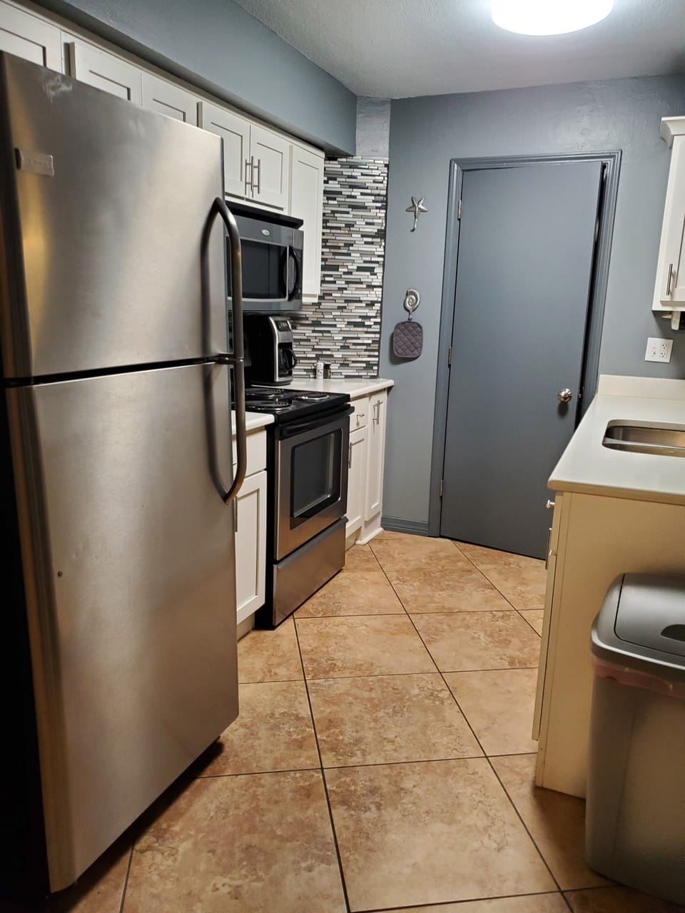 Kitchen view from second bedroom doorway