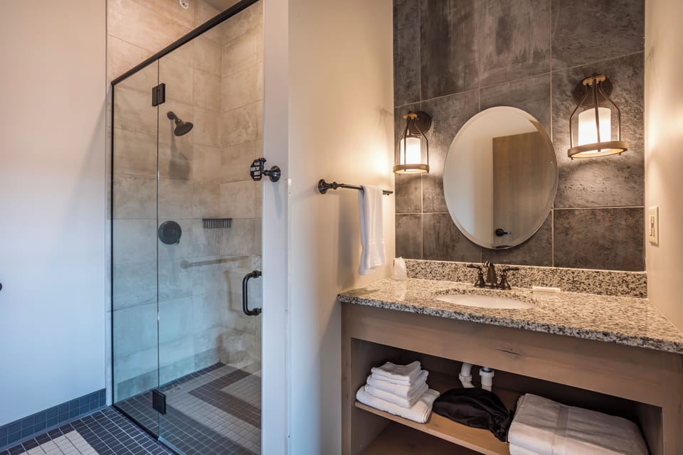Room 14 @ 102 West Main Street | Bathroom | Shower, hair dryer, towels