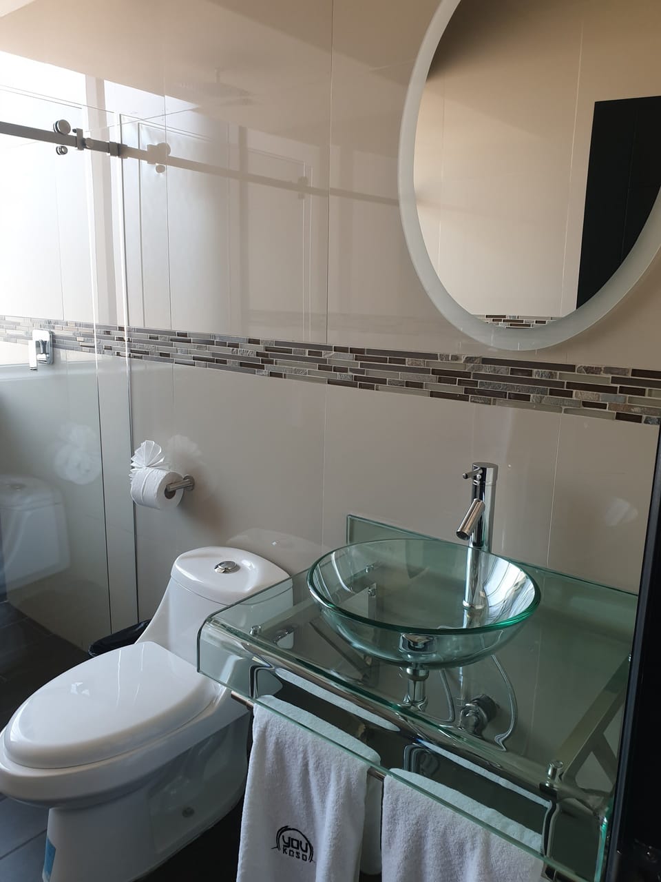 Shower, rainfall showerhead, hair dryer, towels