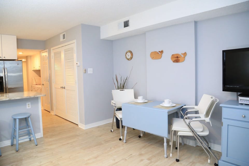 Convertible dining table and stackable chairs.