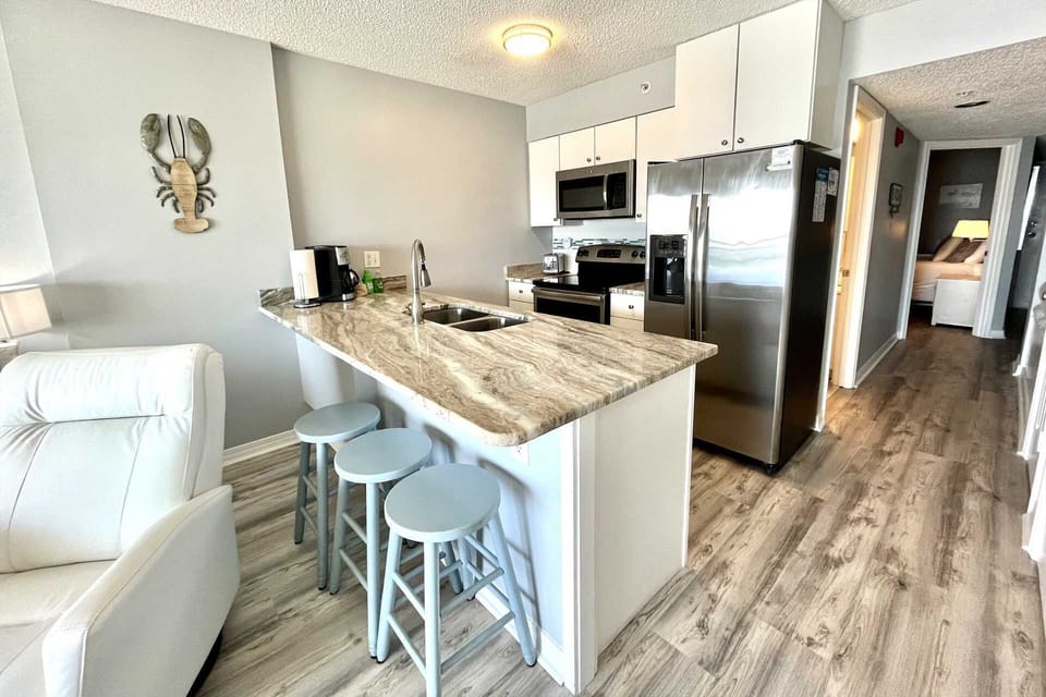 Gorgeous granite counters provide ample space for prepping meals.