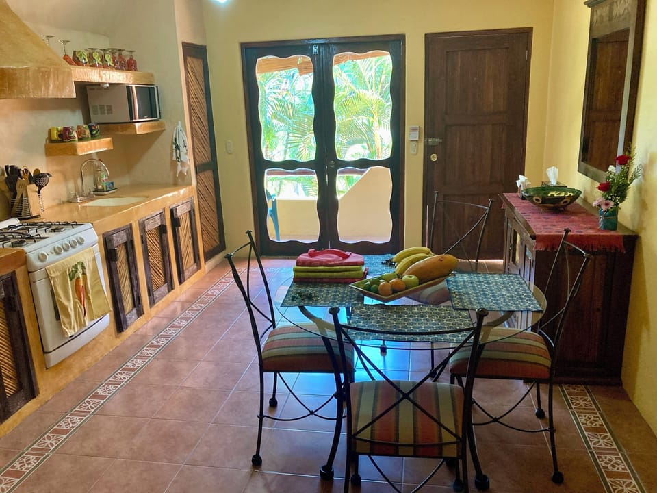 Kitchen, door entry, entry to balcony,  and dining table