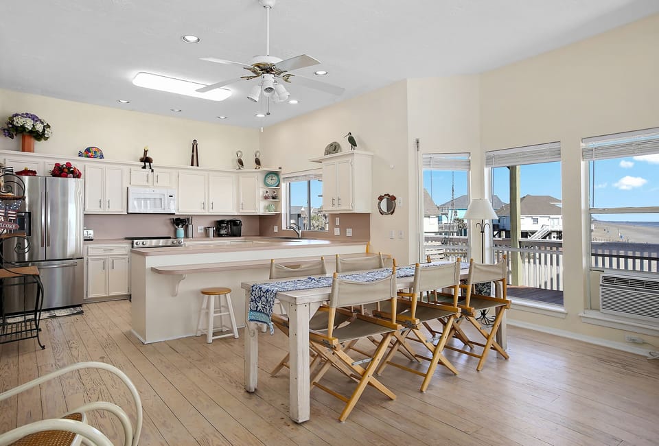 Kitchen and dining area. Dining table sits 8 comfortably. 