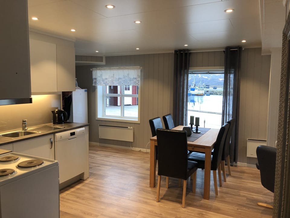 Premium Apartment, 3 Bedrooms, Sea View (Rorbu Makkaur) | Living area | Flat-screen TV, toys