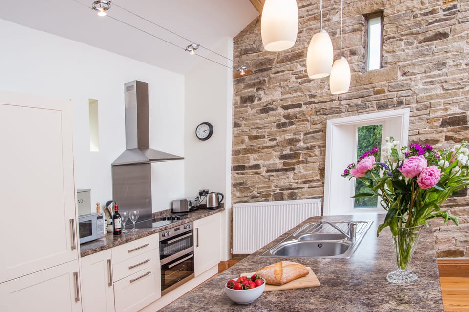 full size kitchen with oven, fridge freezer and dishwasher