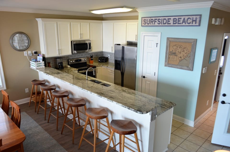 Extra bar seating overlooking the fully equipped kitchen.