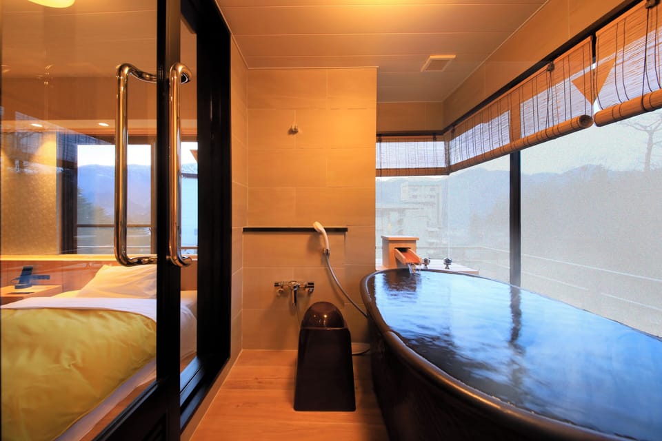 Japanese-Western style room with hot spring bath | Down comforters, in-room safe, desk, blackout drapes