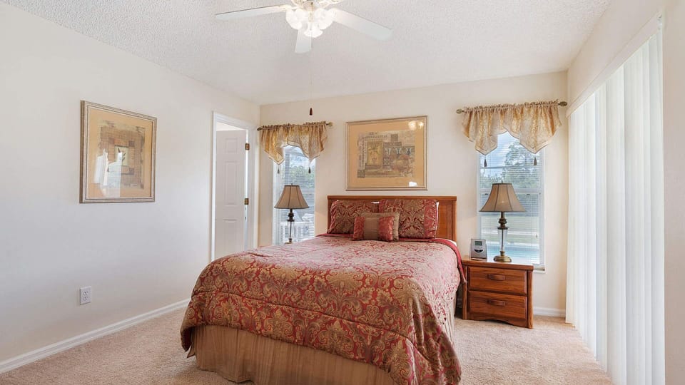 Retreat to Bedroom 1, featuring a plush queen bed and private bathroom.