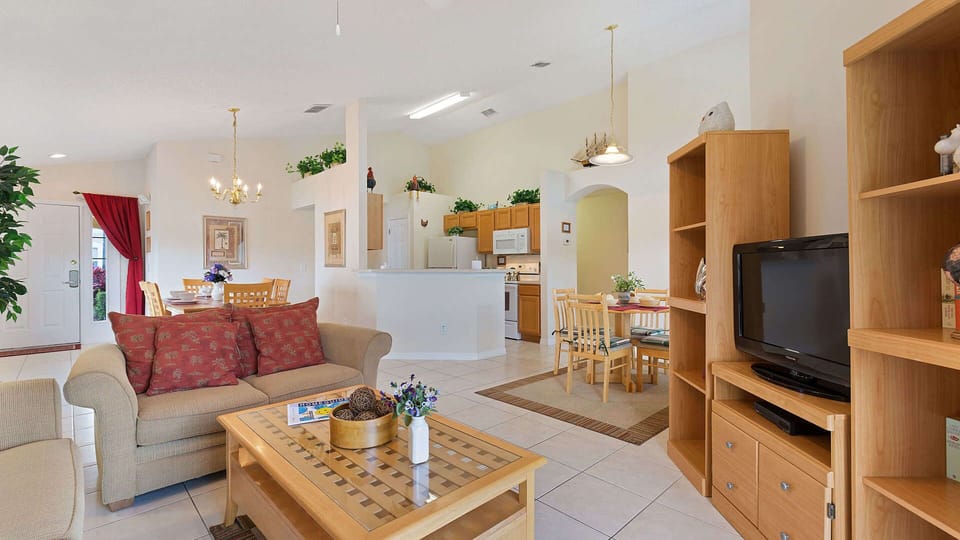 Enjoy our cozy family room, fully equipped kitchen, and spacious dining table.