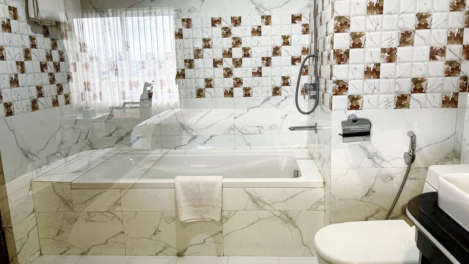 Family Room | Bathroom | Shower, free toiletries, slippers, towels