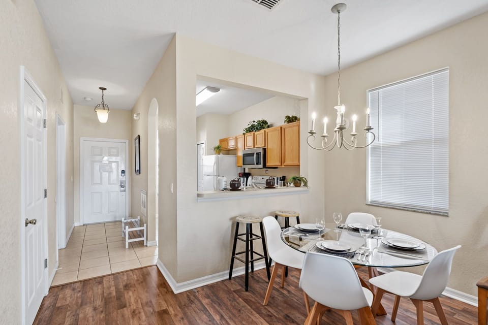 The countertops between the living room and kitchen provide additional seating.