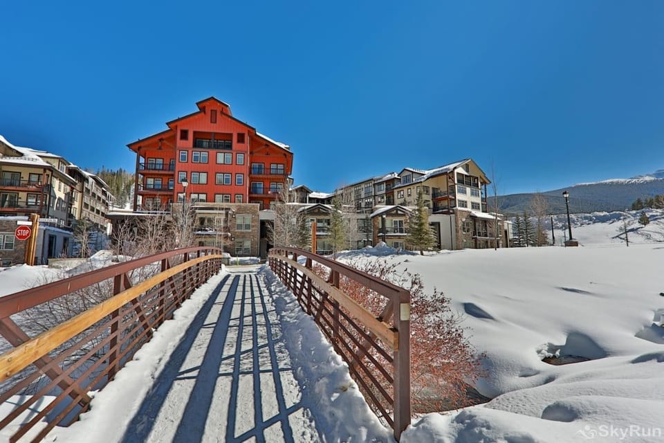- Scenic bridge leading to property with snowy alpine views   - Picturesque entryway setting in Winter Park mountainside   - Ideal location with charm and year round mountain access