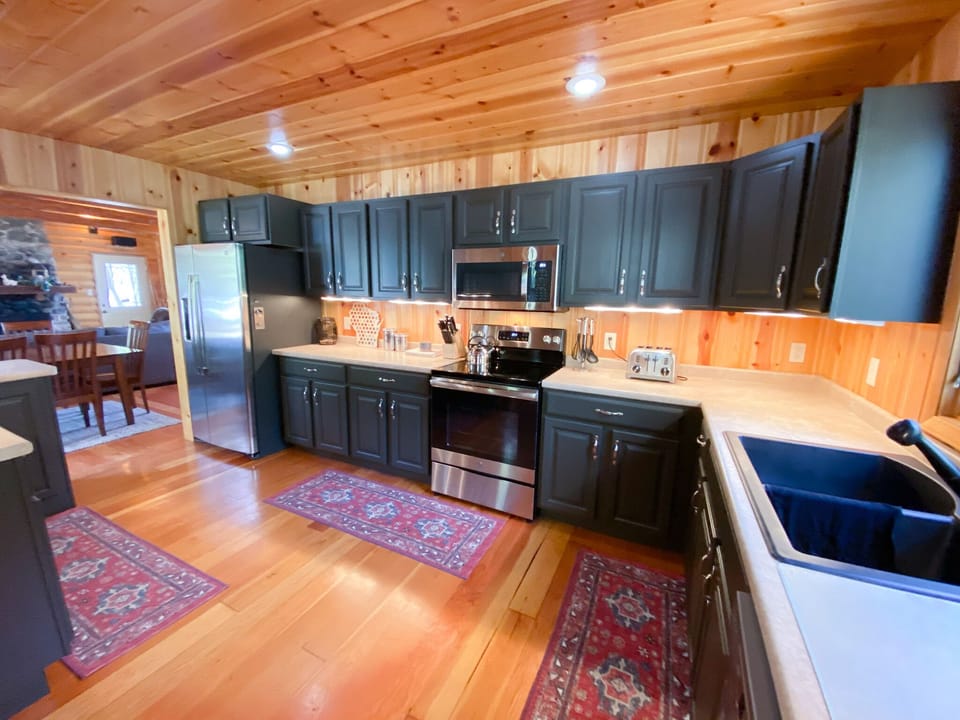 Fully equipped kitchen with new appliances to prepare all of your meals while at the cabin.