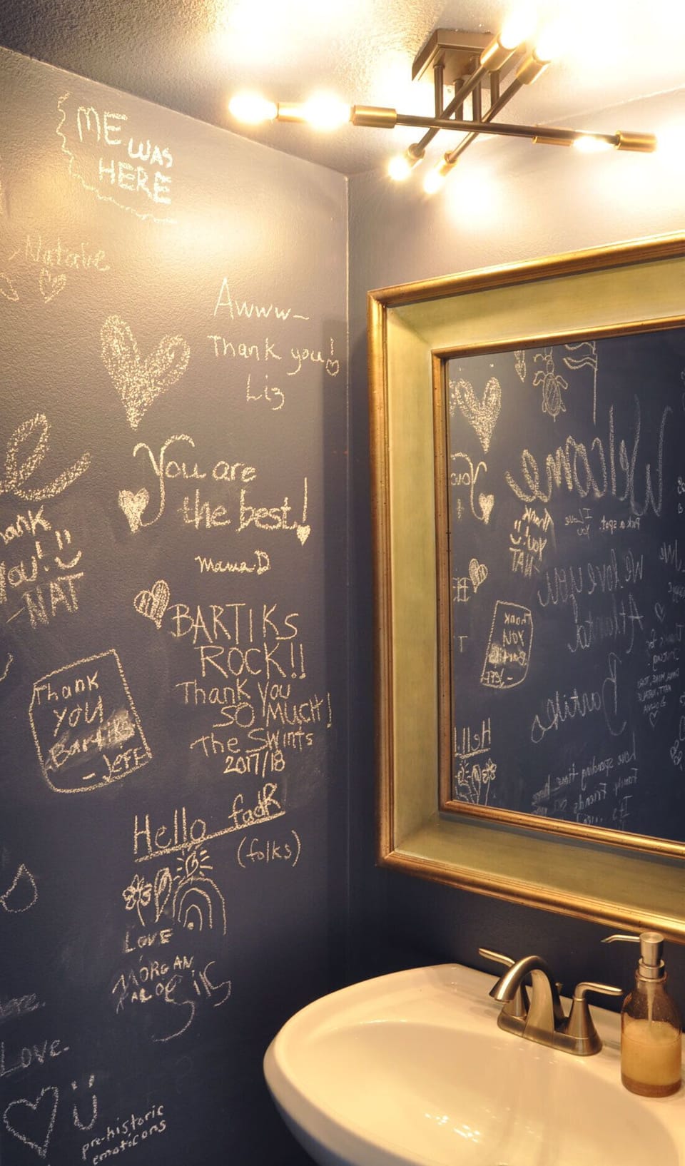 Navy chalkboard walls makes for a fun guest book in our half bath on main floor