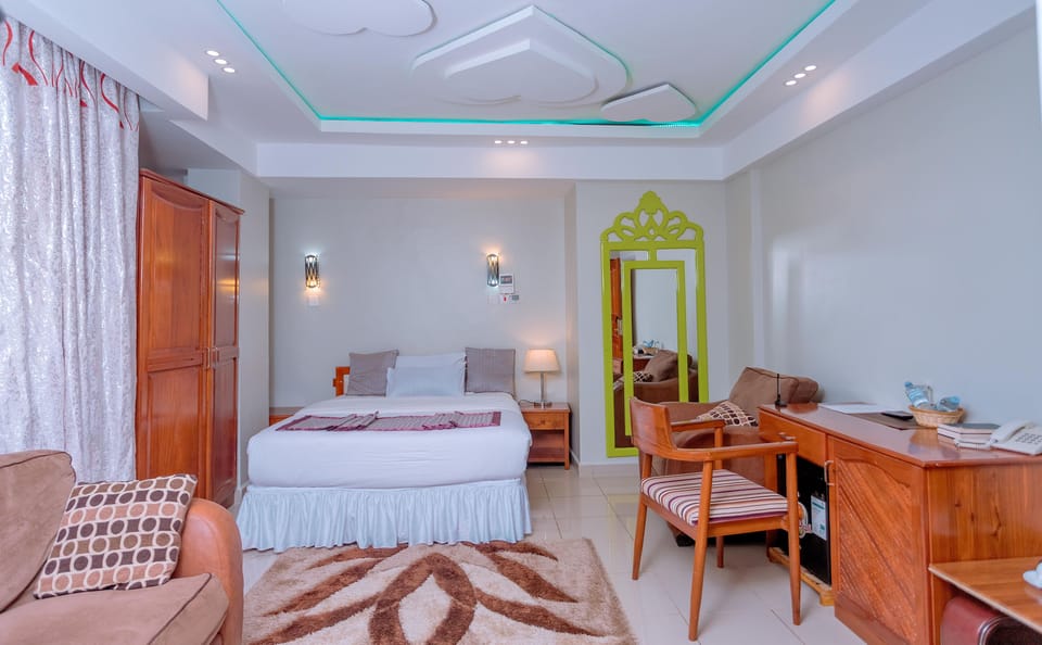 Deluxe Room | Laptop workspace, blackout drapes, rollaway beds, free WiFi