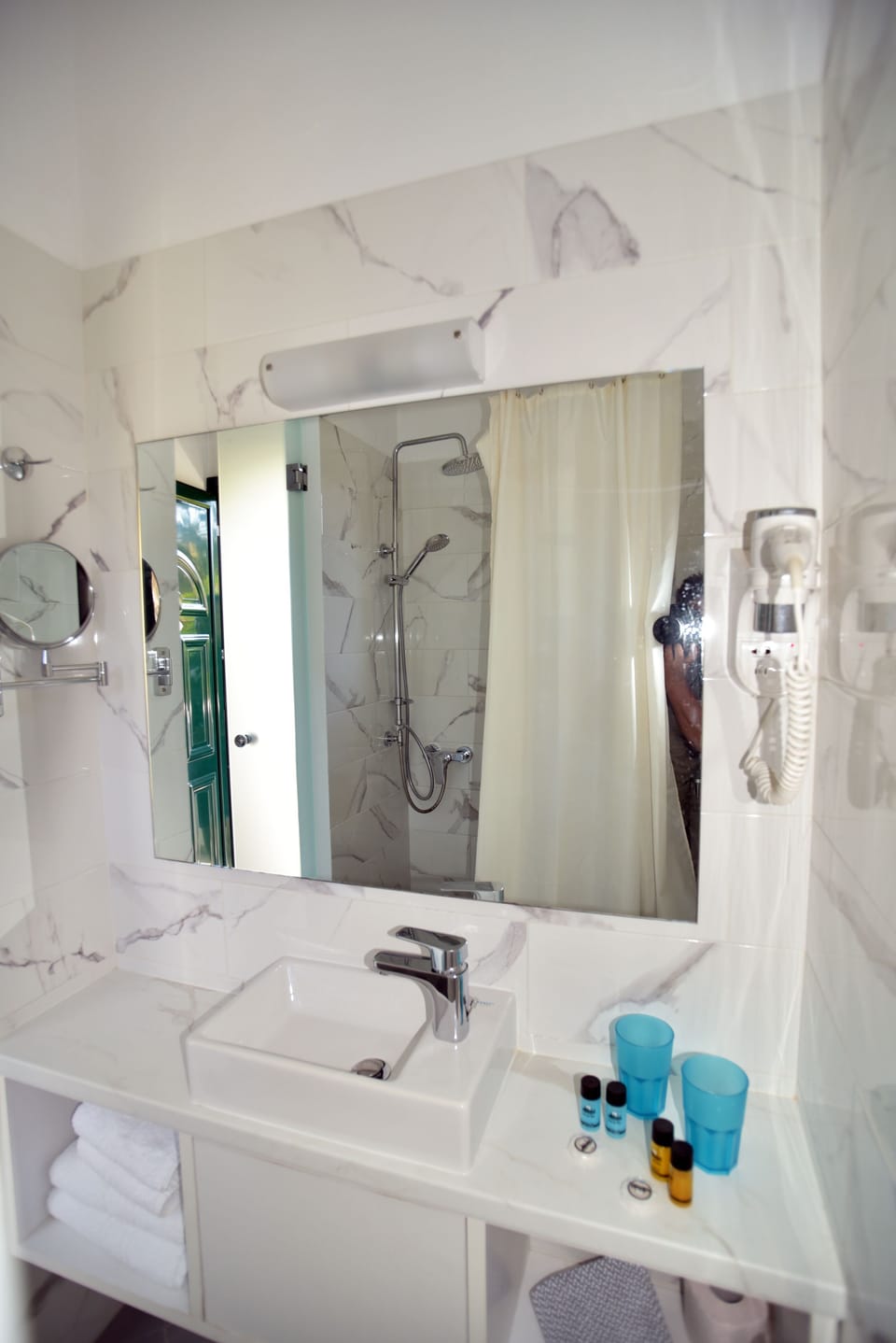 Shower, rainfall showerhead, hair dryer, towels