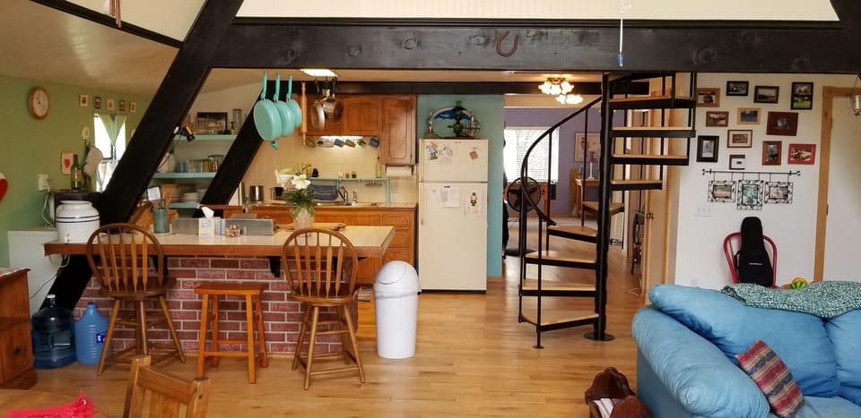 TV room in the back, loft above