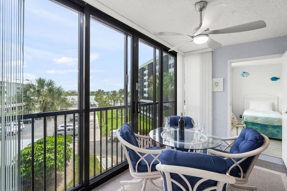 Open up the blinds on the enclosed balcony and catch a glimpse of the intracoastal