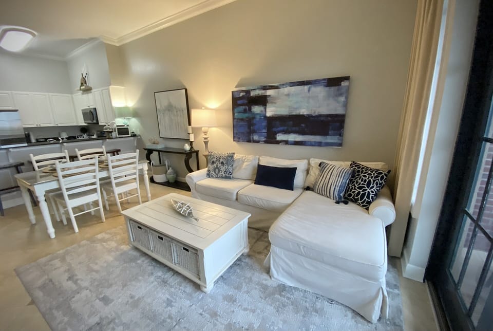 Open Floor Plan: Kitchen, Dining Area, Living Room.