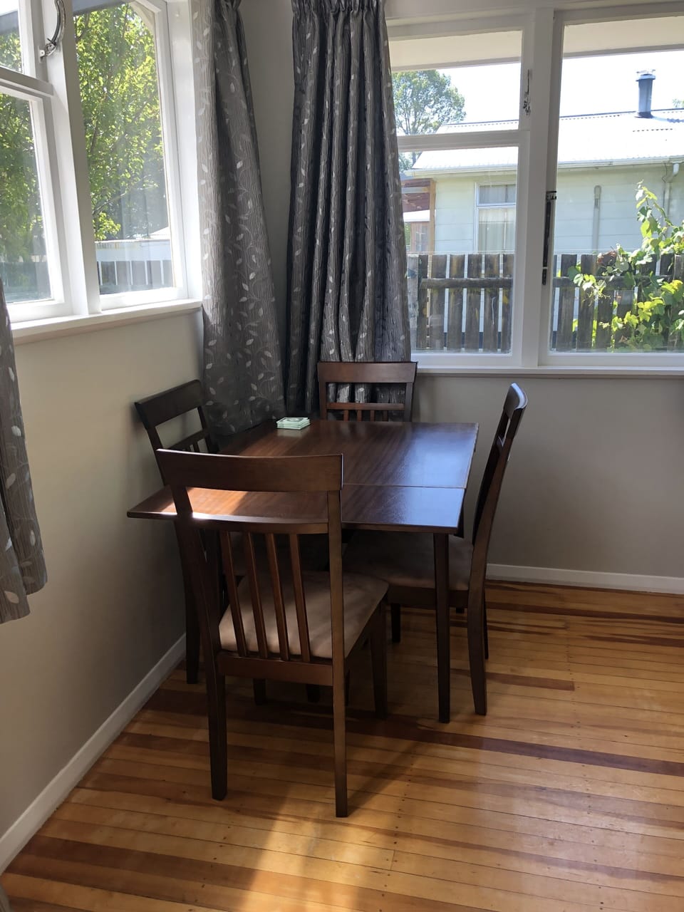dining area. table extends. There are 3 chairs and 2 stools