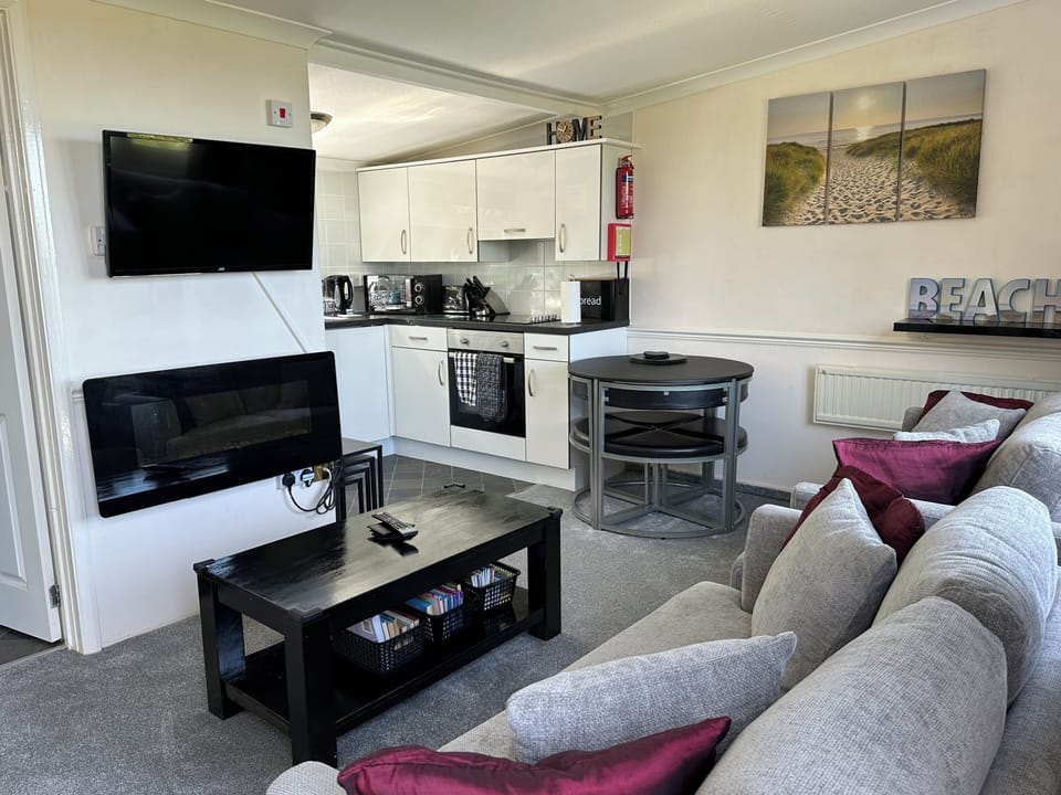 View inside the Chalet of open plan lounge & kitchen