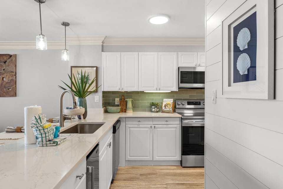 Fully equipped Kitchen with Gulf Views, including Ice Maker, Retractable Faucet, Open to Dining and Living Room