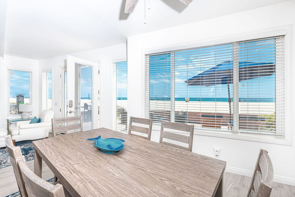 The dining area includes seating for 6 guests.
                