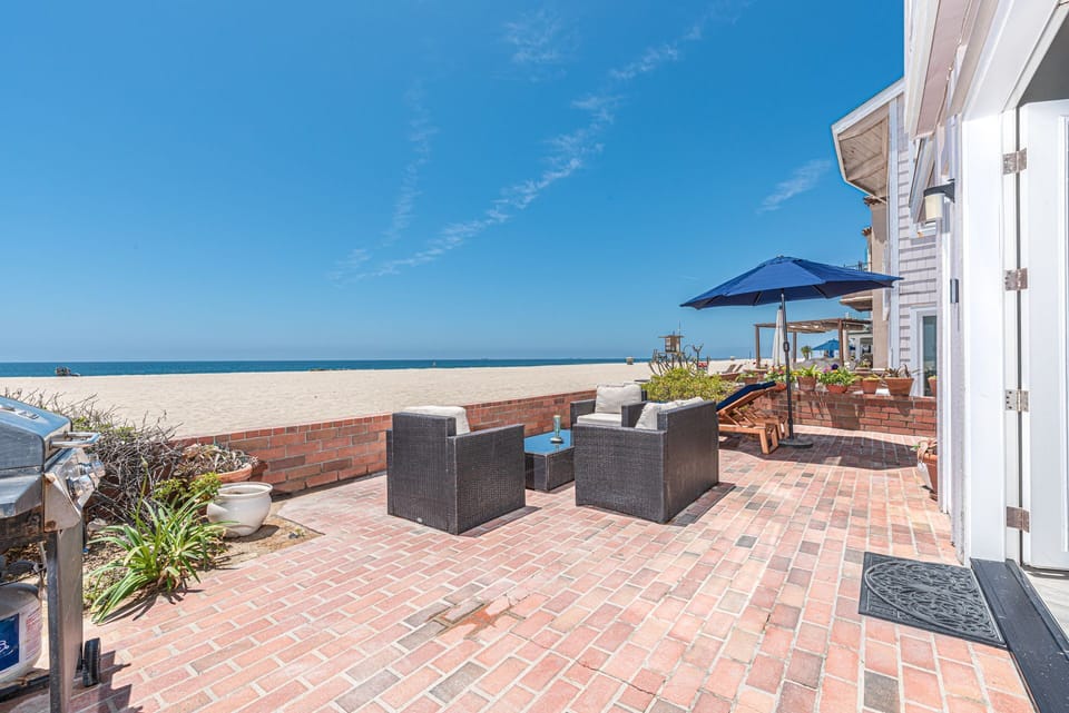 Patio doors open out to the oversized oceanfront patio. Due to the moderate climate, this home, like most in the area, does not include central air.
                