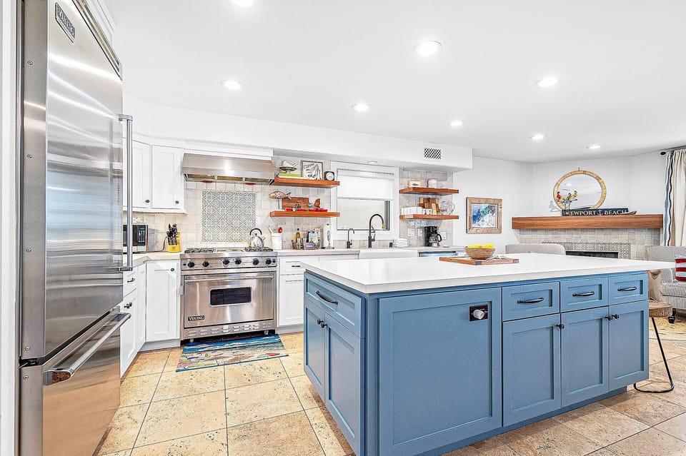 Gather around the spacious island in this bright coastal kitchen.
                
