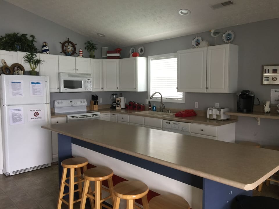 Great kitchen with BIG island and well stocked dishes, cookware & appliances. 