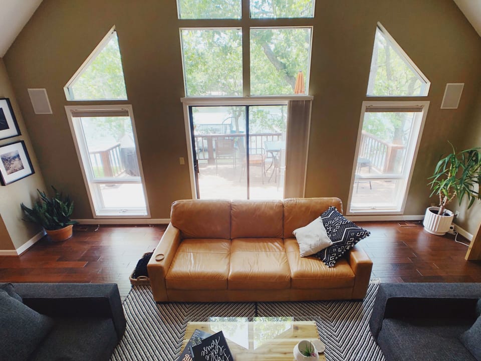 Upstairs living room with view of water and fireplace.