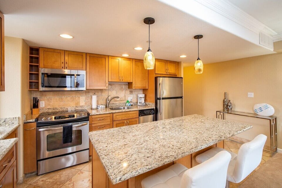 Enjoy cooking at your fully equipped kitchen with a kitchen island for easy meal preparation